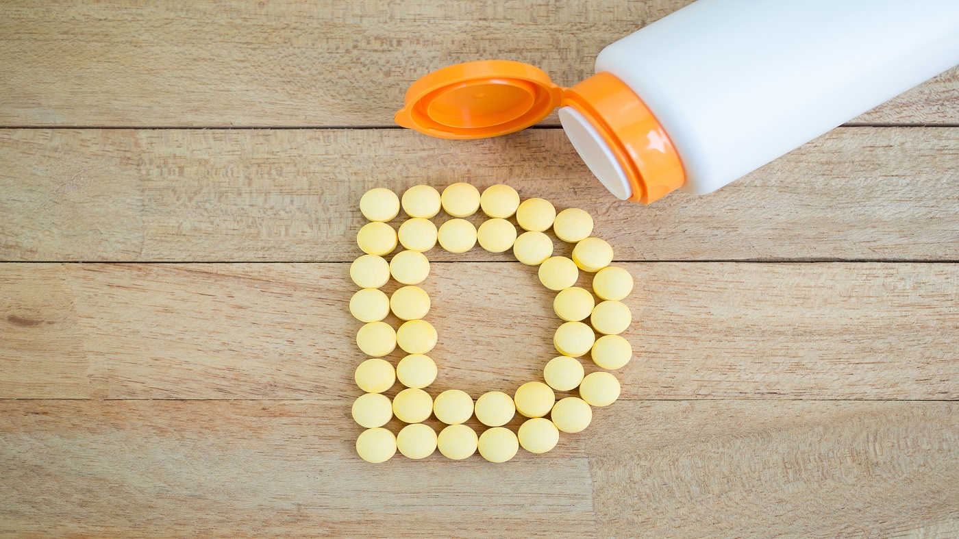 Too Much Vitamin D? -- bottle of vitamin D and vitamin D tablets in the shape of the letter D