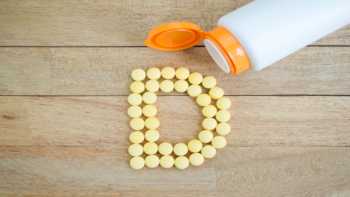 Too Much Vitamin D? -- bottle of vitamin D and vitamin D tablets in the shape of the letter D