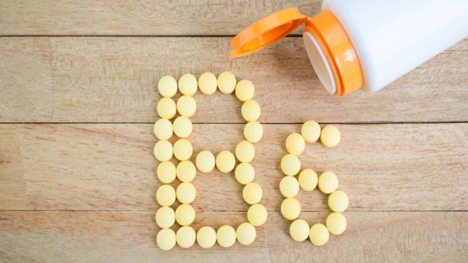 Vitamin tablets placed on a table to spell B6