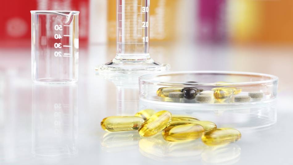 Do Supplement Companies Have to Test Their Products? -- supplements in glassware in laboratory