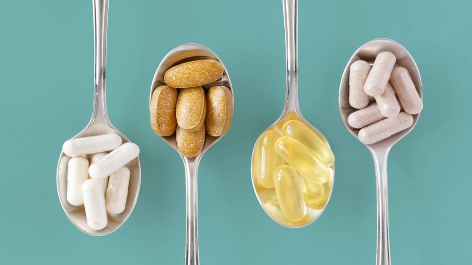 Vitamins & Minerals That Should Be Taken Together or Separately -- various vitamins in spoons