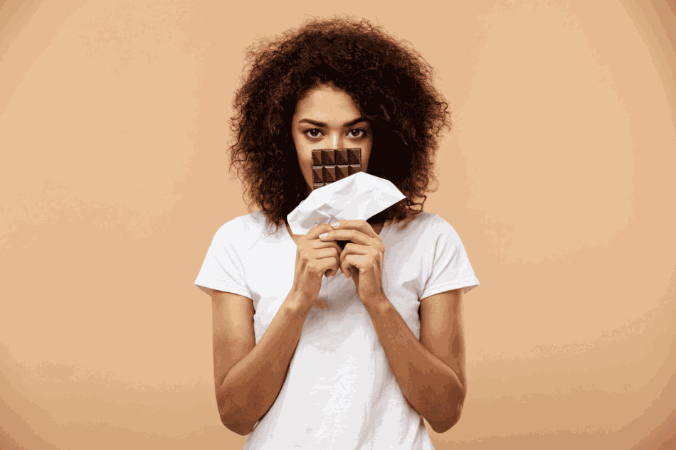 Woman Holding Chocolate Bar