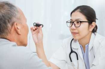 Doctor Shining Light for Patient Eye Exam