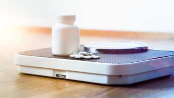 7-Keto DHEA for Weight Loss? -- supplement and pills on scale
