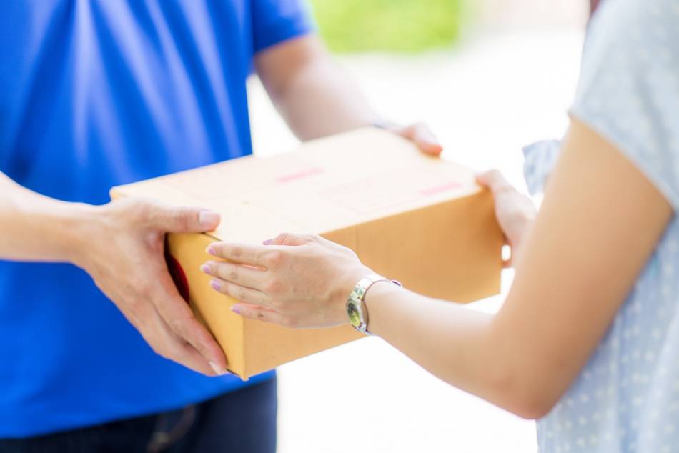 Heat's Effect on Supplements in the Mail -- Woman receiving a package