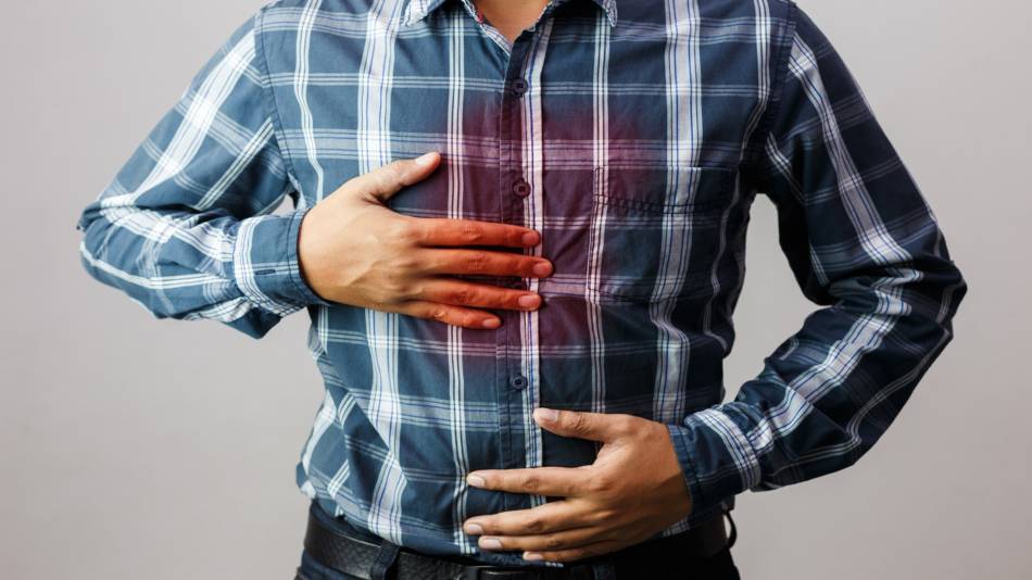 Supplements for Indigestion and Heartburn -- man with heartburn pain