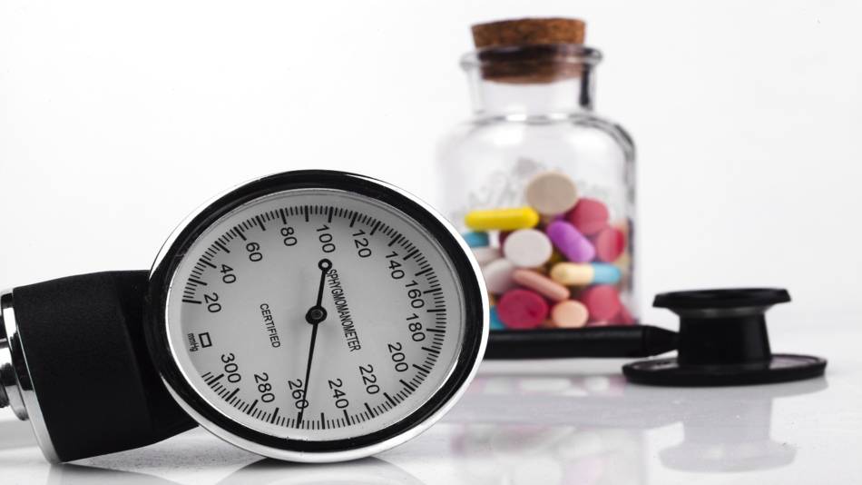 Supplements that can lower, or raise blood pressure -- blood pressure cuff and bottle of pills