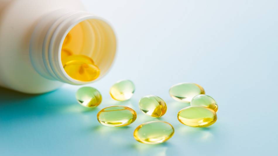 Do Fish Oil Supplements Contain Soy? -- bottle of fish oil and fish oil capsules 