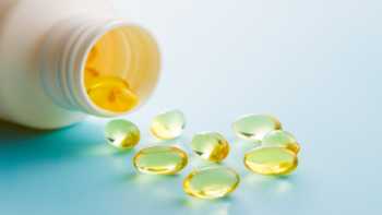 Do Fish Oil Supplements Contain Soy? -- bottle of fish oil and fish oil capsules 