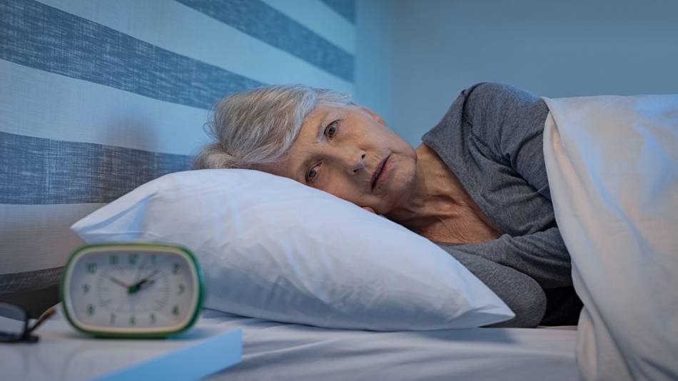 Can Red Yeast Rice Cause Insomnia? -- Woman With Insomnia, Awake In Bed