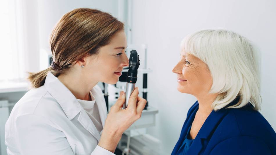 Supplements for Macular Degeneration -- woman getting eye examination