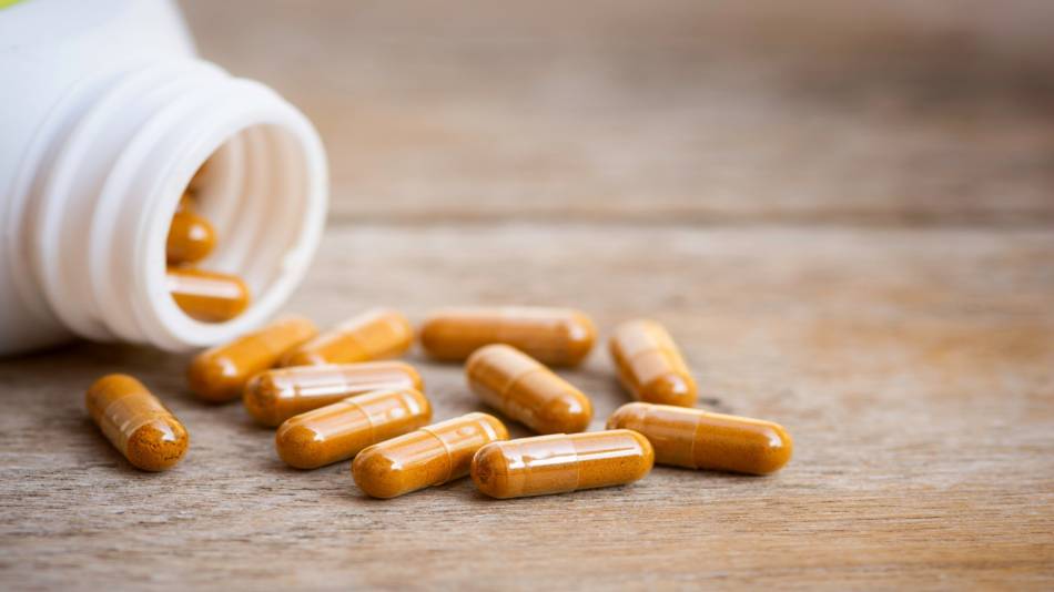 Is It Safe to Take Turmeric or Curcumin Supplements Long-Term? -- Bottle of Turmeric Capsules