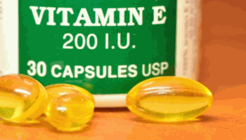 Vitamin E Pills and Close Up on Bottle Label