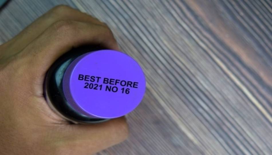 Blue Supplement Bottle with Best By Date on Lid