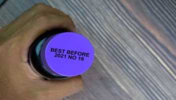 Blue Supplement Bottle with Best By Date on Lid 