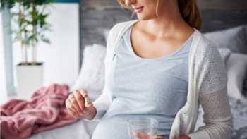 Too Much Folic Acid in Prenatal Vitamins? -- Pregnant woman taking supplements