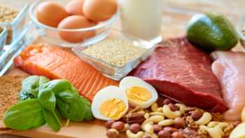 Good Sources of B Vitamins -- selection of healthy foods including eggs, rice, nuts, seeds, salmon, chicken