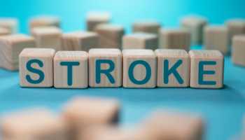 Stroke Spelled on Wooden Blocks Against Blue Background