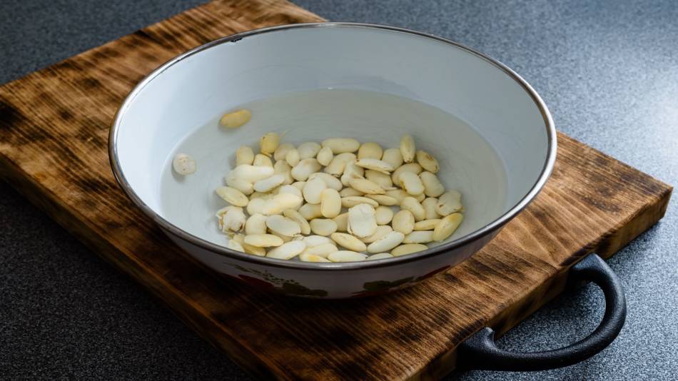Soaking Beans to Remove Phytates -- white beans soaking in a bowl of water