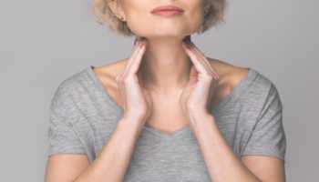 Elderly Woman Checking Thyroid Gland