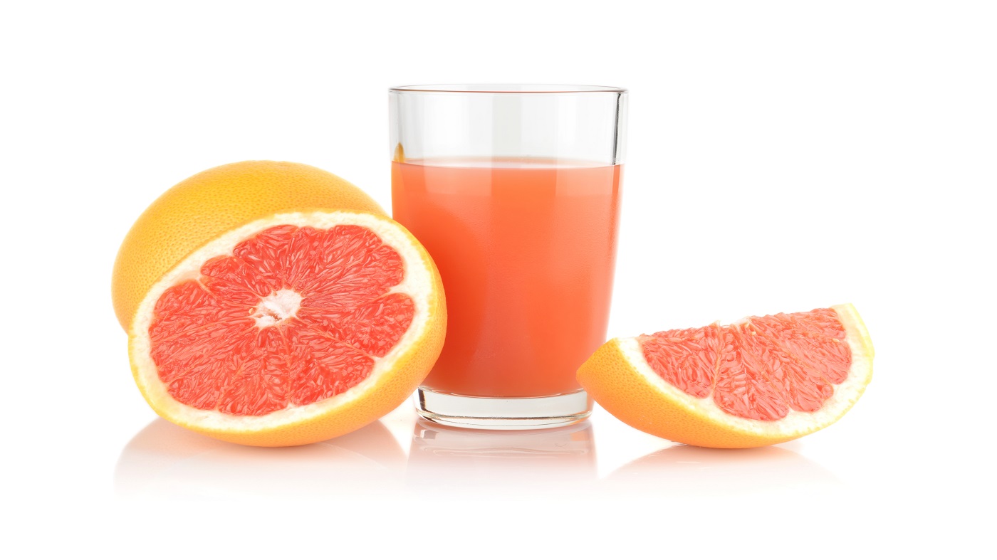 Grapefruit Juice, CYP3A4 and Supplement Interactions -- glass of grapefruit juice and grapefruit halves