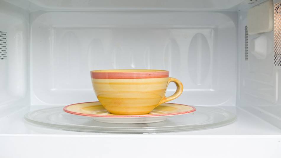 Does Microwaving Green Tea Affect Amounts of EGCG? -- teacup in microwave