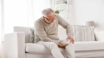 Side Effects of Boswellia -- man holding his knee