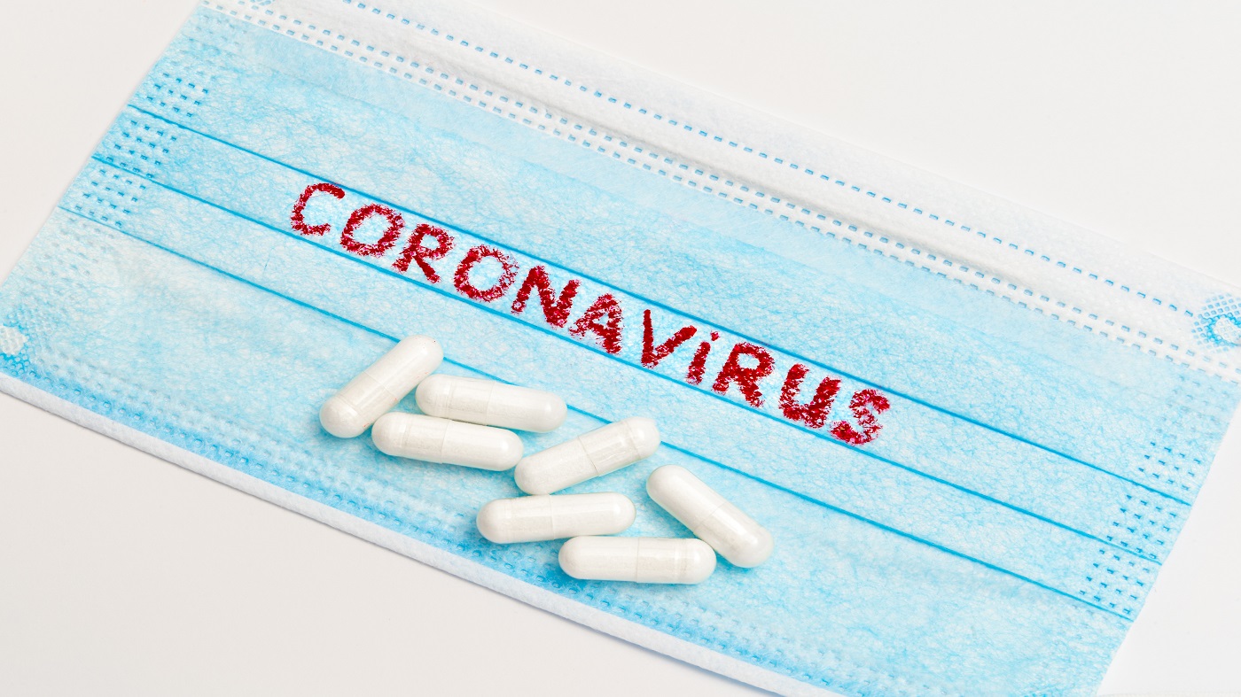 Natural Remedies and Supplements for Coronavirus (COVID-19)? -- coronavirus mask surrounded by pills and supplements