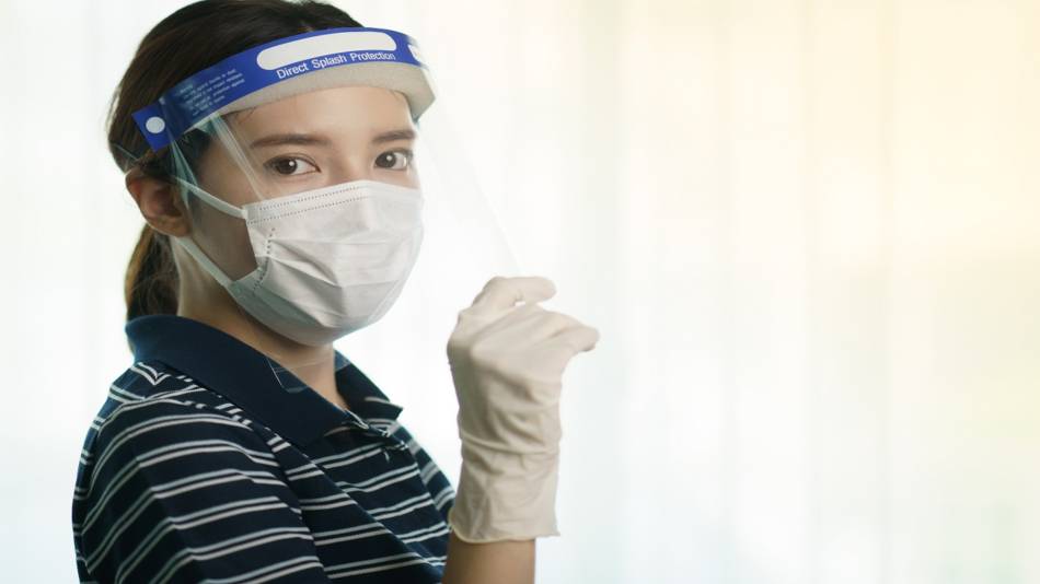 Face Shield to Protect From Coronovirus (COVID-19) -- Woman Wearing Face Shield, Mask and Gloves