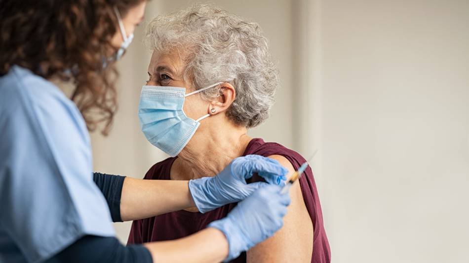 Older woman getting an injection