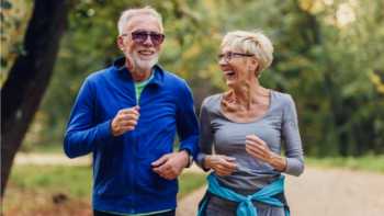 Older couple walking together to exercise