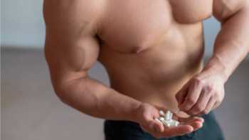 Man at gym taking supplement