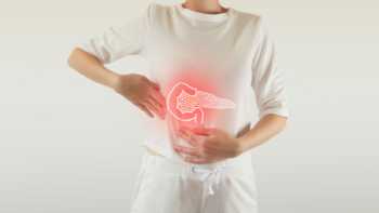 Person with pancreatitis holding their abdomen
