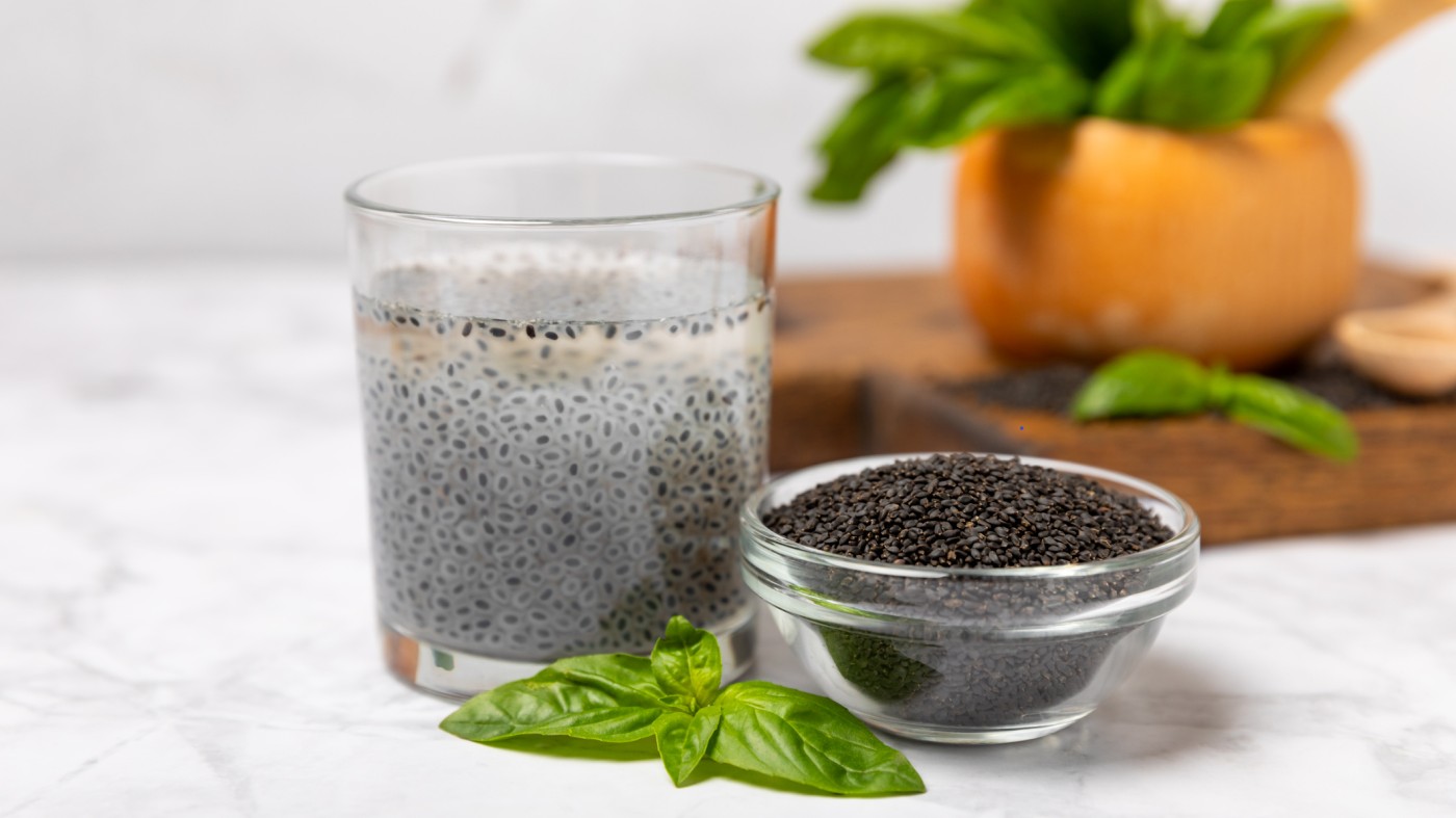 Basil seeds and basil seed beverage on counter