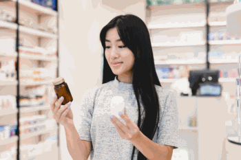 Woman Examining Supplements